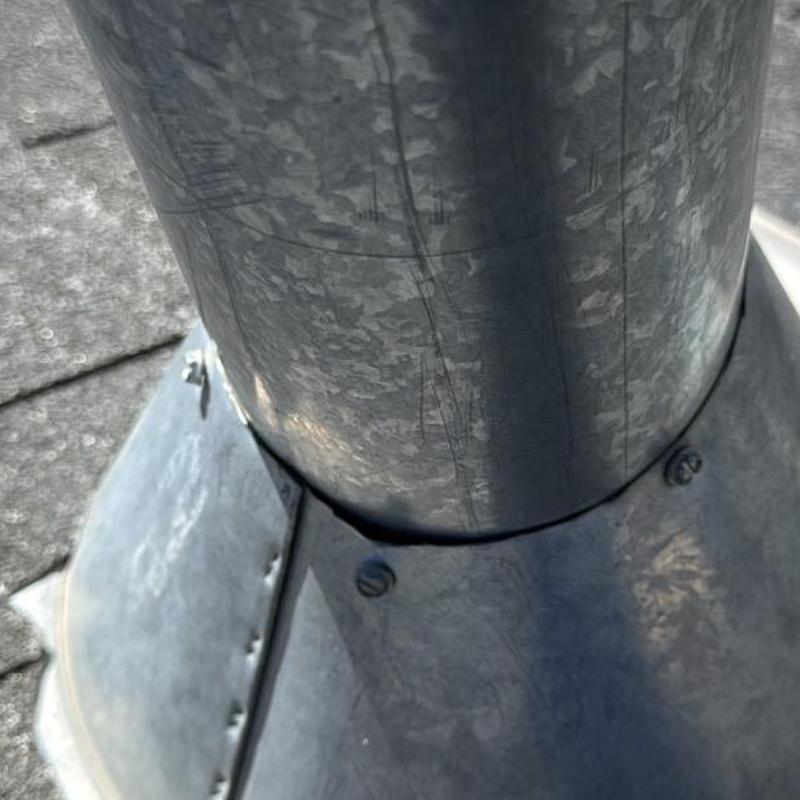 Roof vent flashing on asphalt shingle roof