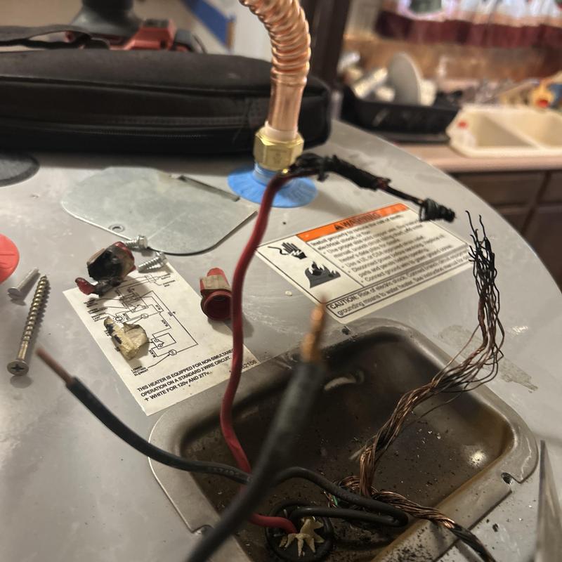 Water heater wiring with damaged exposed wires