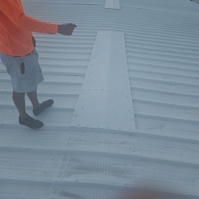 Metal roof with coating inspection and water damage signs