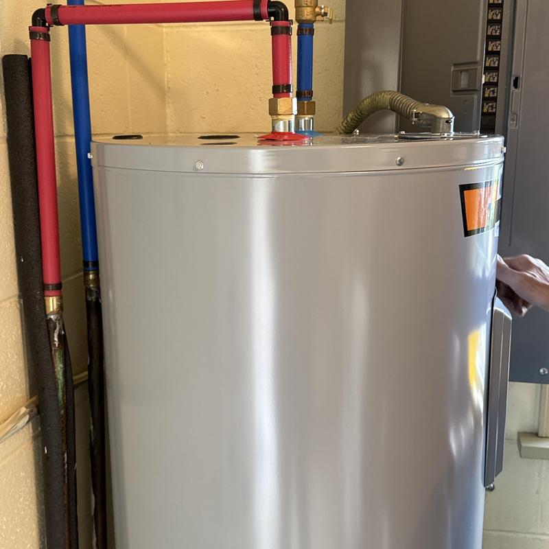 50-gallon State water heater with red and blue pipes