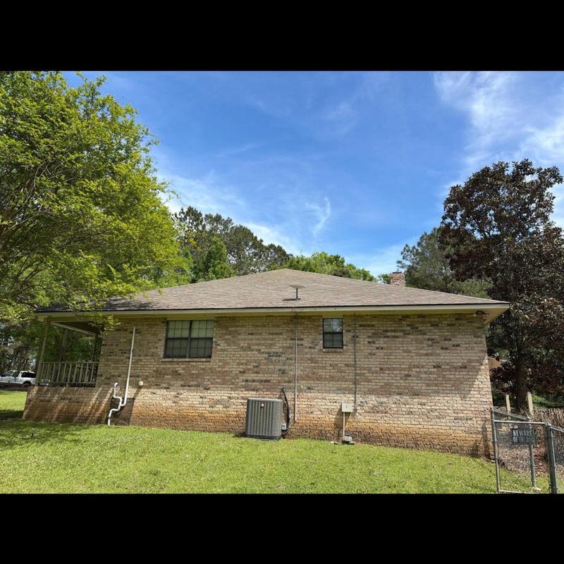 Architectural shingle roof on residential brick house