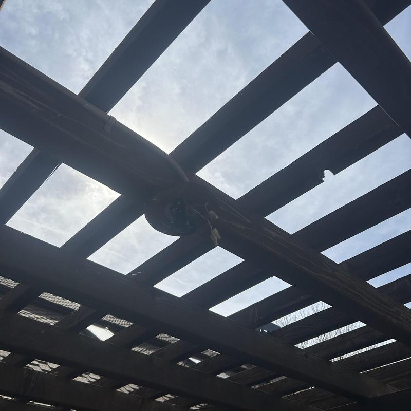 Outdoor-rated exterior ceiling fan installation under pergola