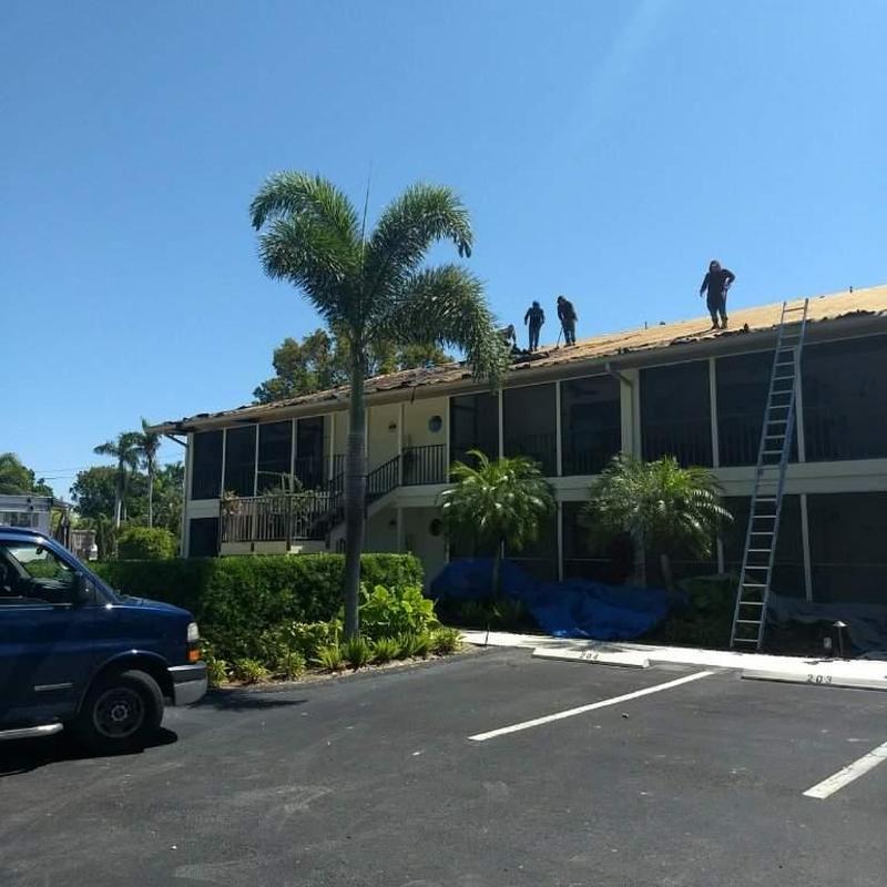 Shingle roof tear-off on two-story condo in Florida
