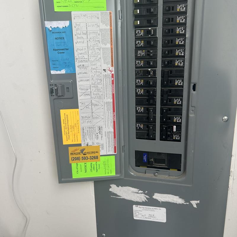 Pool subpanel breaker box with circuit labels and permits