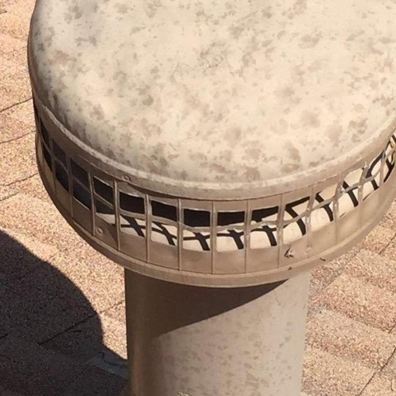 Roof vent pipe cap on asphalt shingle roof Roof vent pipe cap on asphalt shingle roof