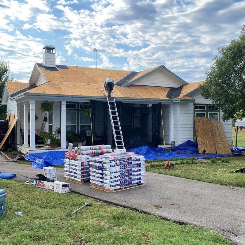 Roof decking replacement with new shingles stacked outside Roof decking replacement with new shingles stacked outside