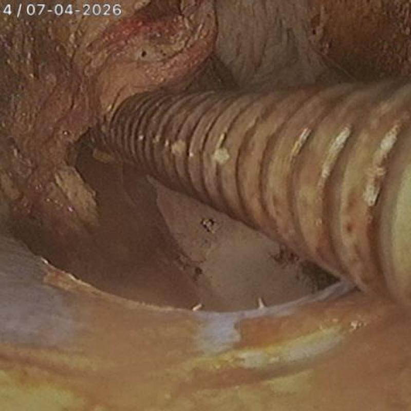 Mainline sewer cleaning with flexible auger inside pipe Mainline sewer cleaning with flexible auger inside pipe