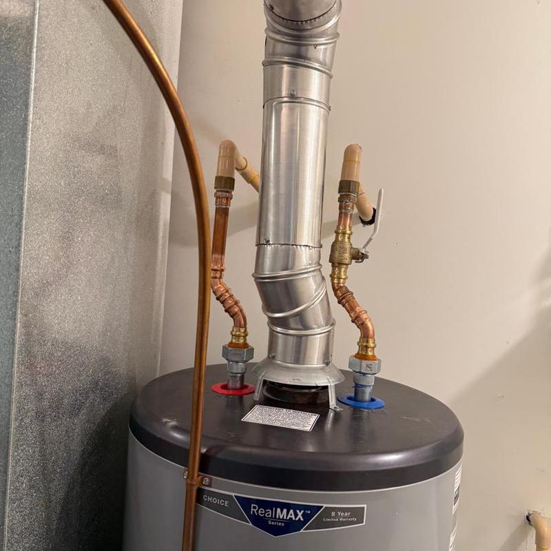 40 gallon electric water heater with vent pipe and copper pipes