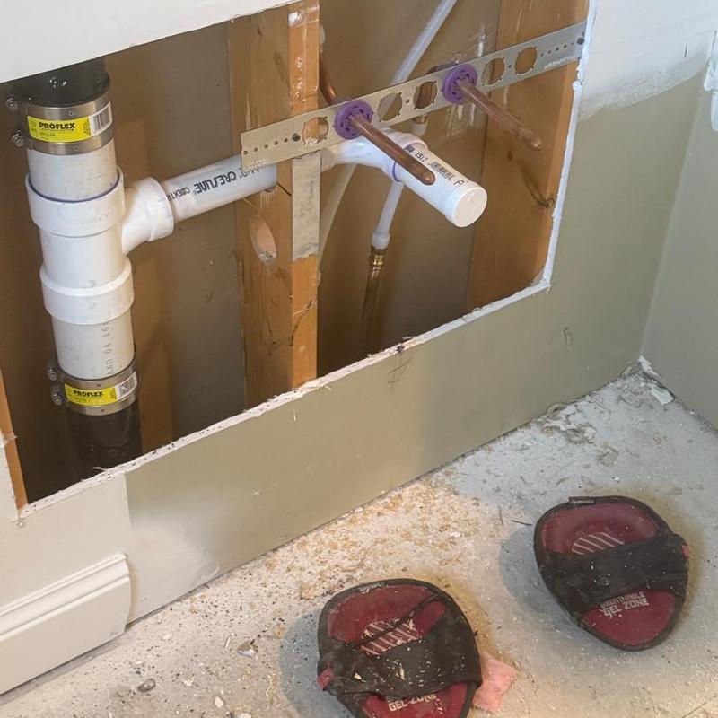 PVC drain and copper water supply rough-in for bathroom