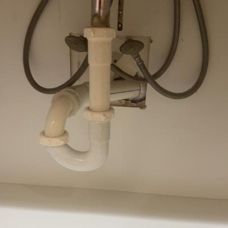 PVC sink drain trap with water supply lines