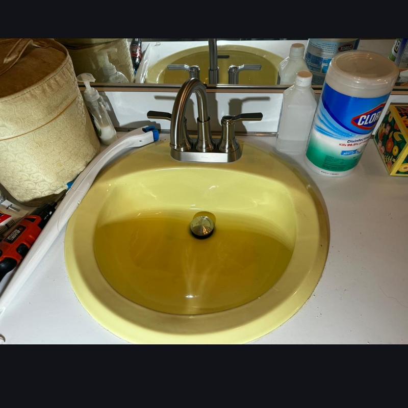 Bathroom faucet with compression stops and feed lines installed