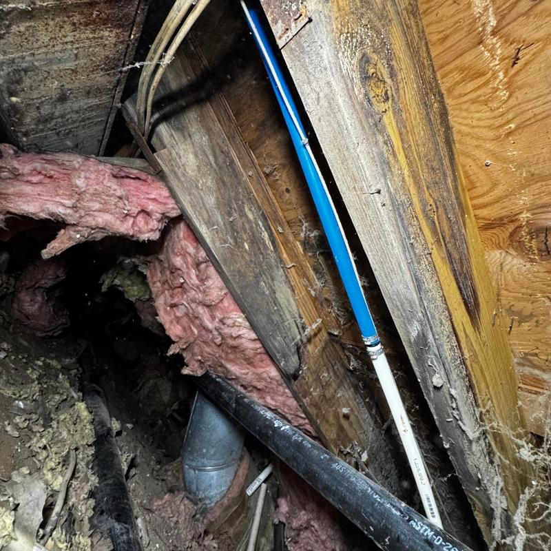 Hose bib plumbing installation in crawl space with piping