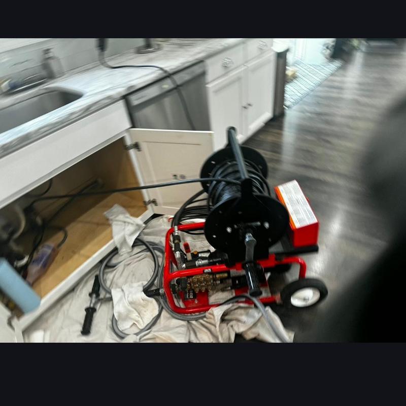 Kitchen drain hydro jetting machine setup under sink