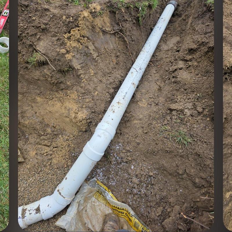 4-inch PVC septic bypass pipe installation in trench