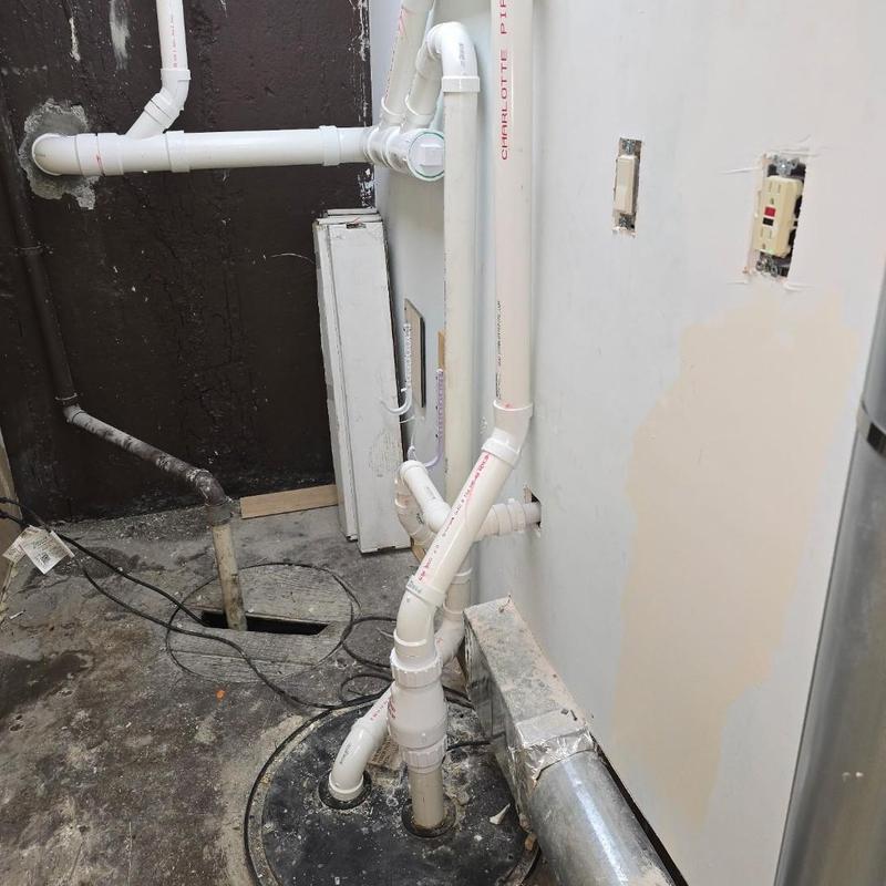 PVC sewer line reroute in basement closet