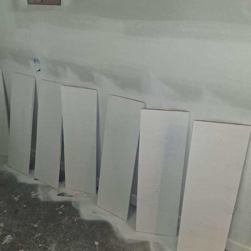 Interior drywall panels drying during house painting