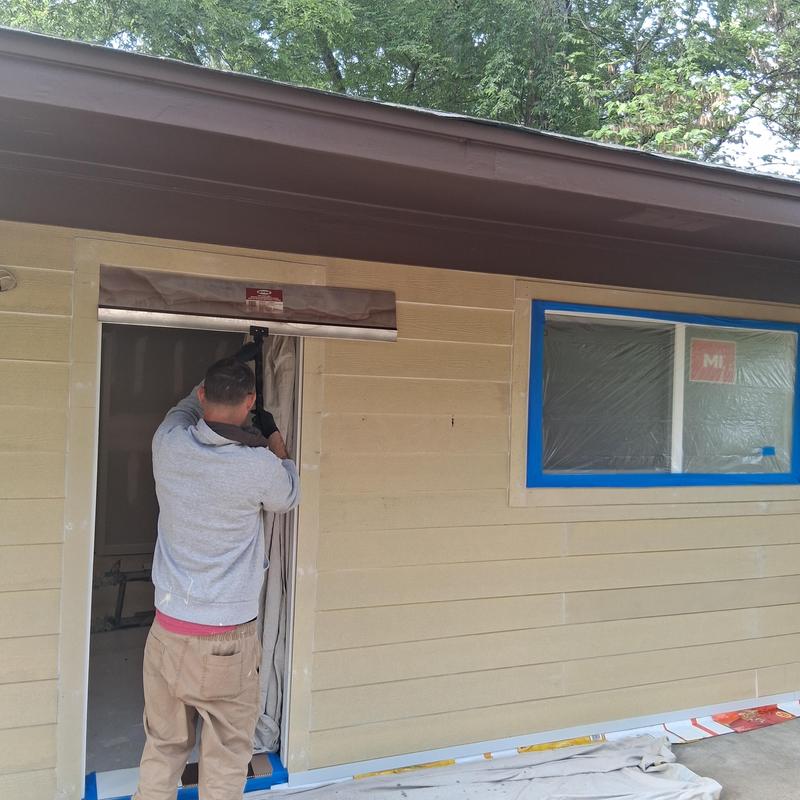 Exterior siding and trim painting with door prep in Pearl MS