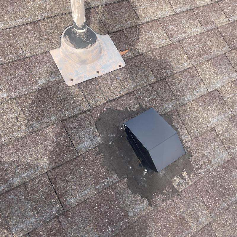 Roof vent flashing with new sealant on shingles