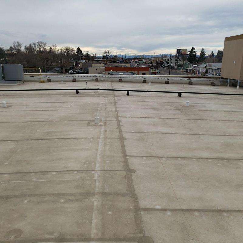 Duralast PVC flat roof with cracks and seam damage