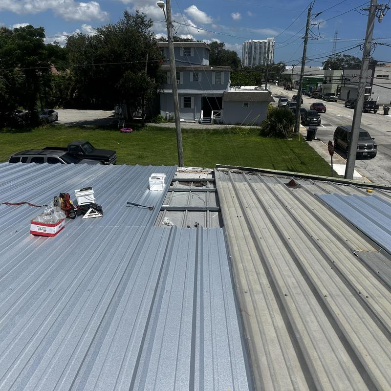Metal roof panel replacement with tools on site Metal roof panel replacement with tools on site