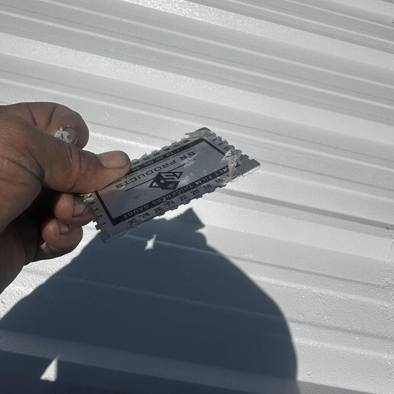 Metal roof acrylic coating thickness gauge in hand Metal roof acrylic coating thickness gauge in hand