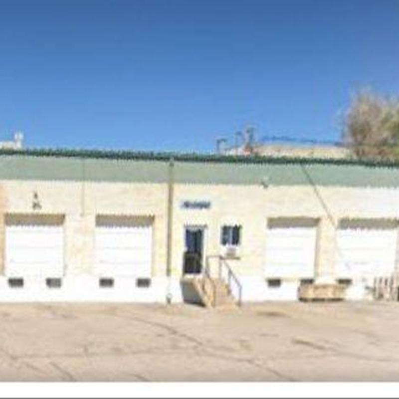 Metal roof inspection showing rusted screws and wear