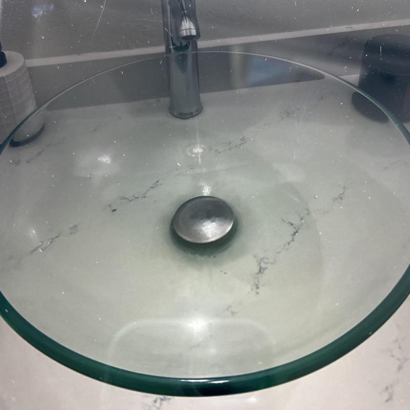 Glass sink with installed pop-up drain assembly