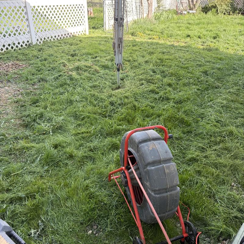 Septic tank inspection camera in backyard grass