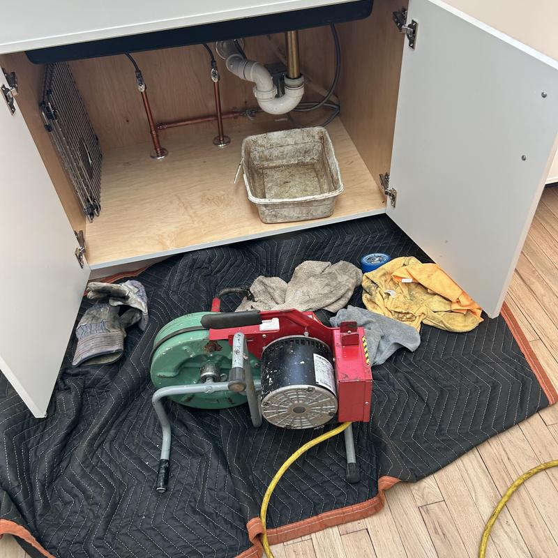 Kitchen sink drain line with drain cleaning machine Kitchen sink drain line with drain cleaning machine