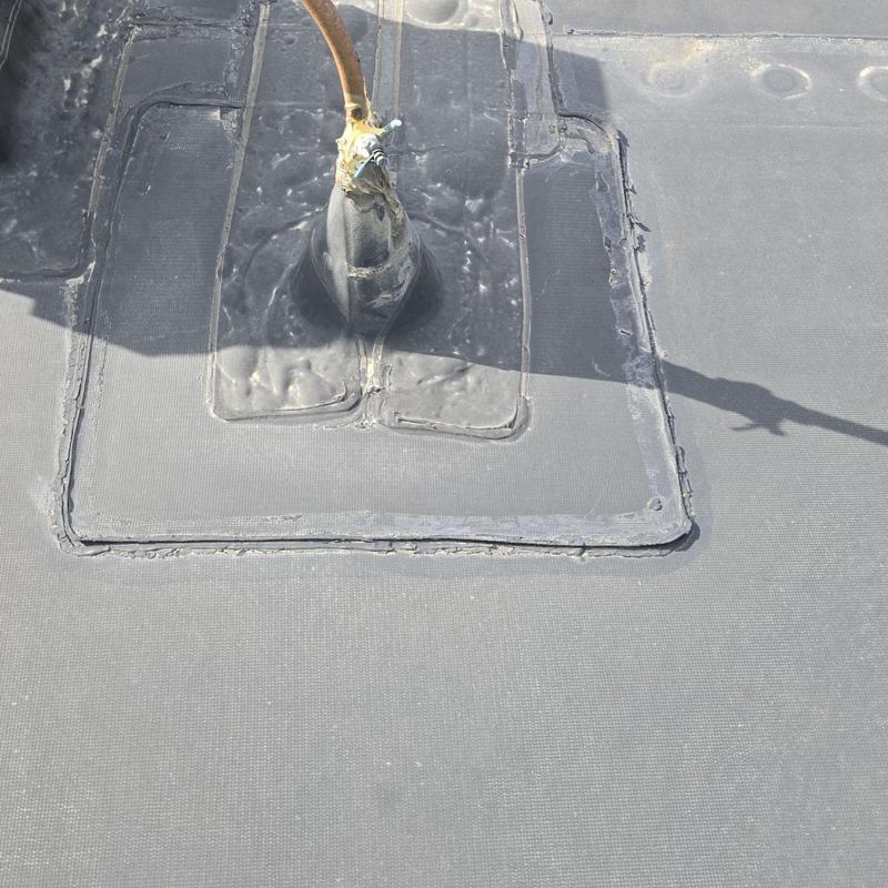 Flat roof pipe jack with sealed compromised area