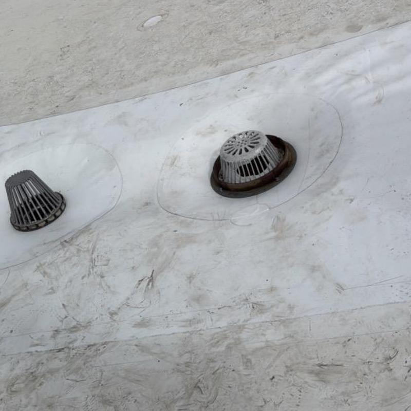 TPO roof drains on commercial gym roof surface