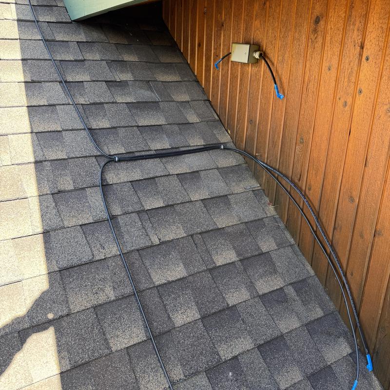 240 V heat tape installed on asphalt shingle roof