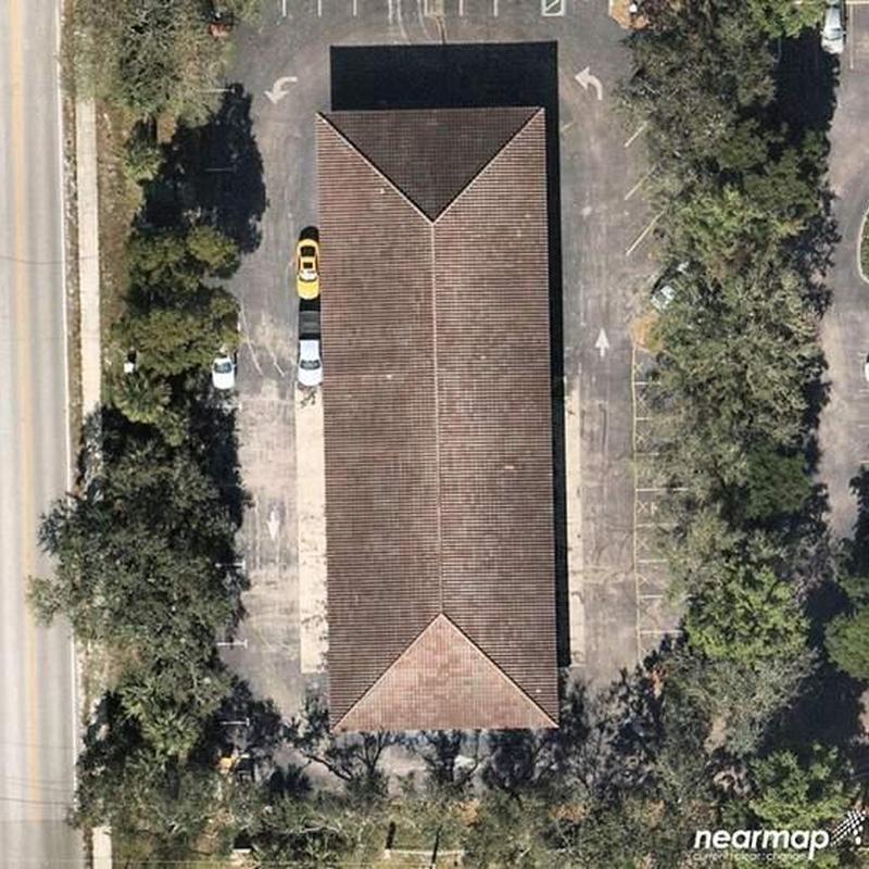 Concrete tile roof with severe damage and wear