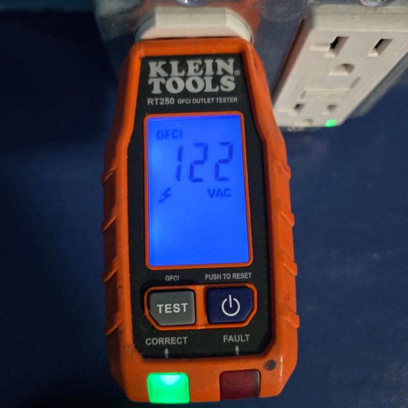 GFCI outlet voltage tester showing 122 VAC reading GFCI outlet voltage tester showing 122 VAC reading
