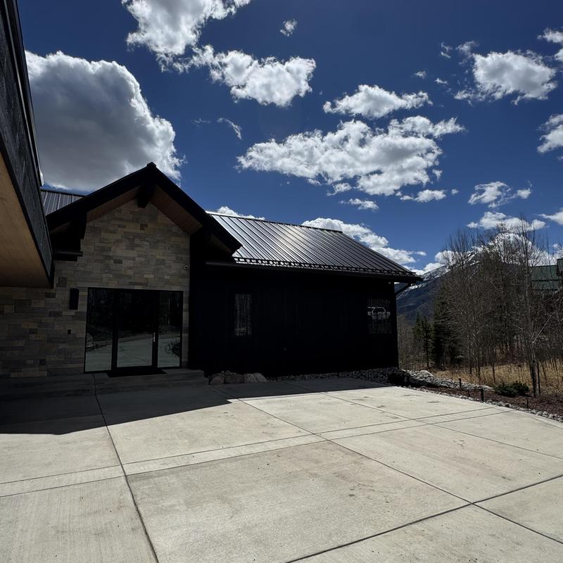 6 inch seamless gutters and snow fencing on home