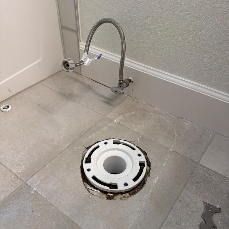Toilet flange installation below tiled floor with water hookup