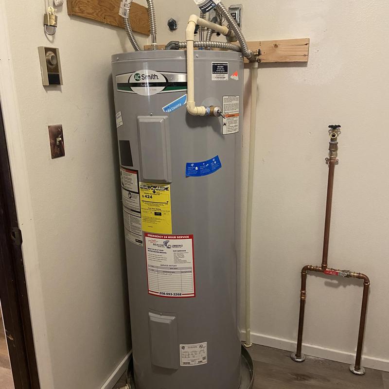 Water heater reinstalled with new piping and drain pan