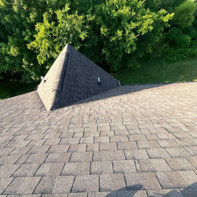 Asphalt shingle roof inspection showing wear and flashing issues