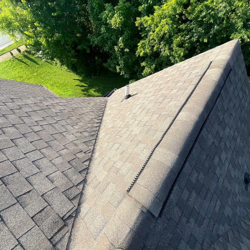 Asphalt shingle roof with ridge and ventilation inspection