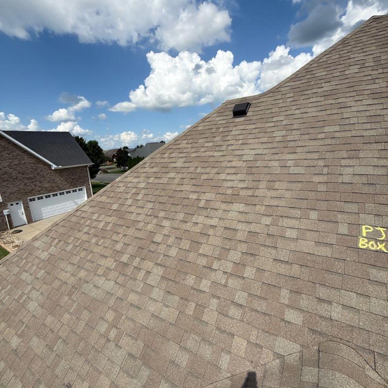 Asphalt shingle roof with hail damage markings