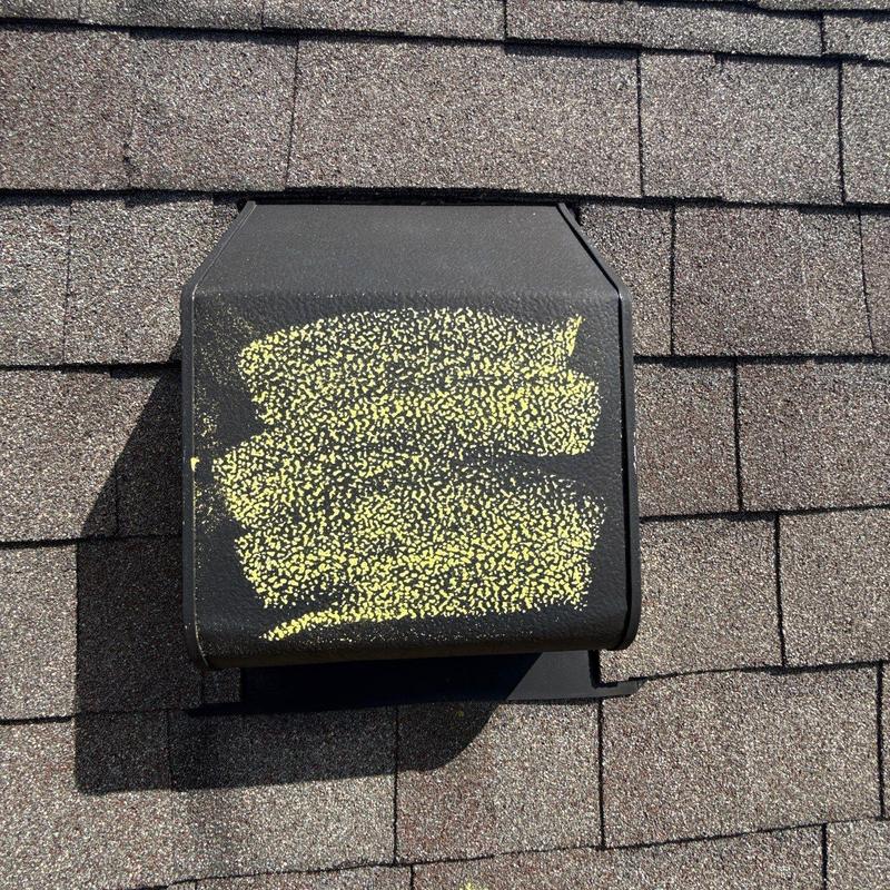 Roof vent with hail damage marked for repair