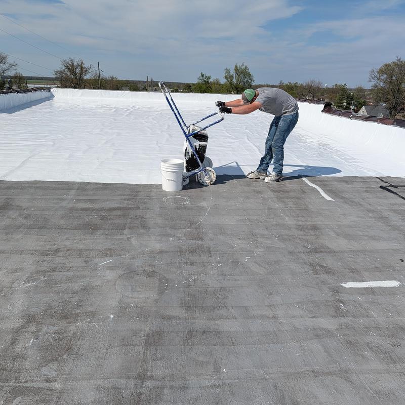 Elastomeric coating application on flat commercial roof