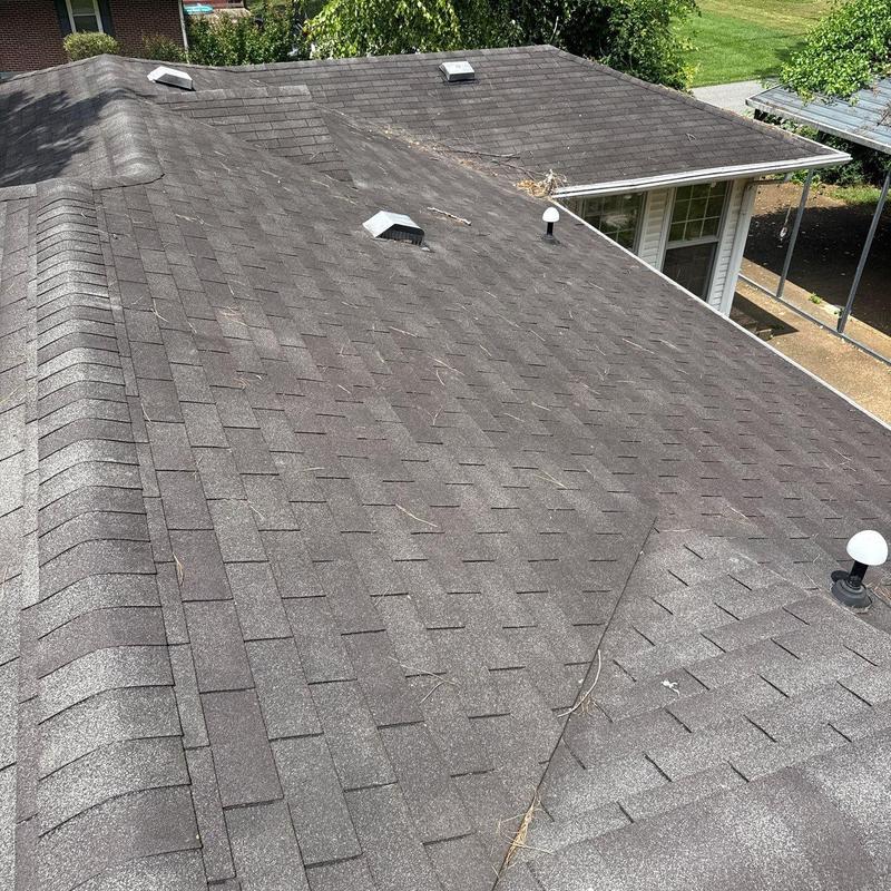 Asphalt shingle roof with hail damage inspection