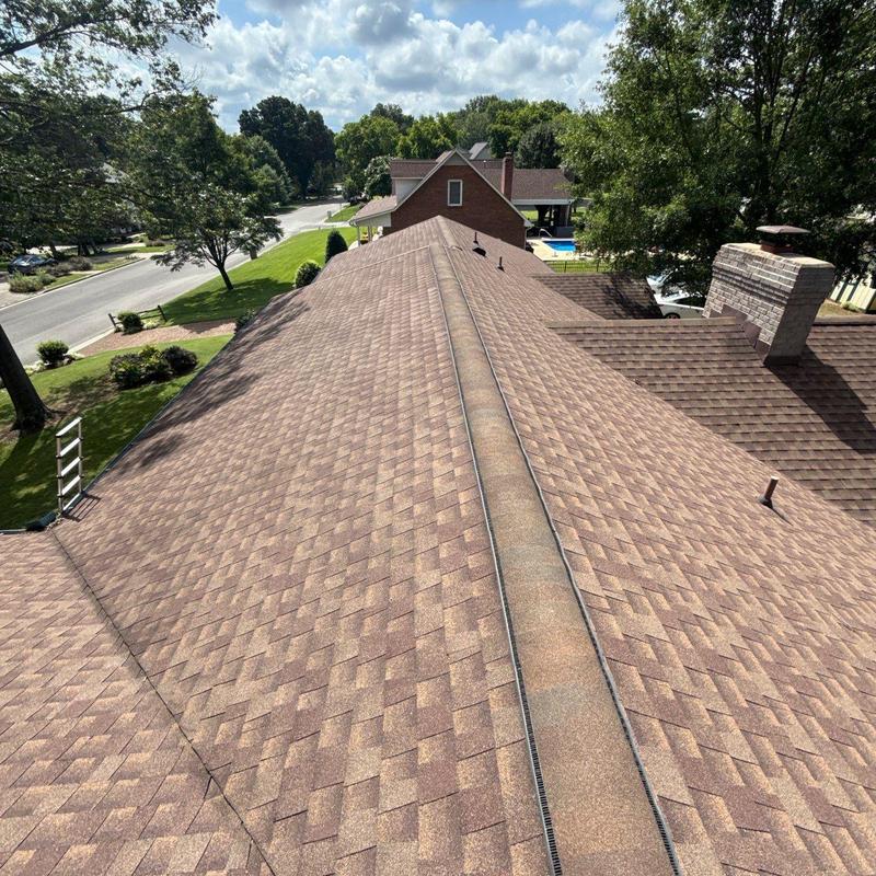Asphalt shingle roof inspection in residential neighborhood