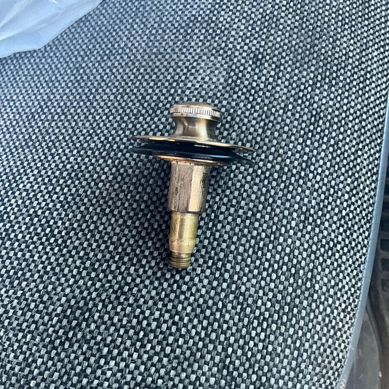 Tub drain stopper removed for repair or replacement Tub drain stopper removed for repair or replacement