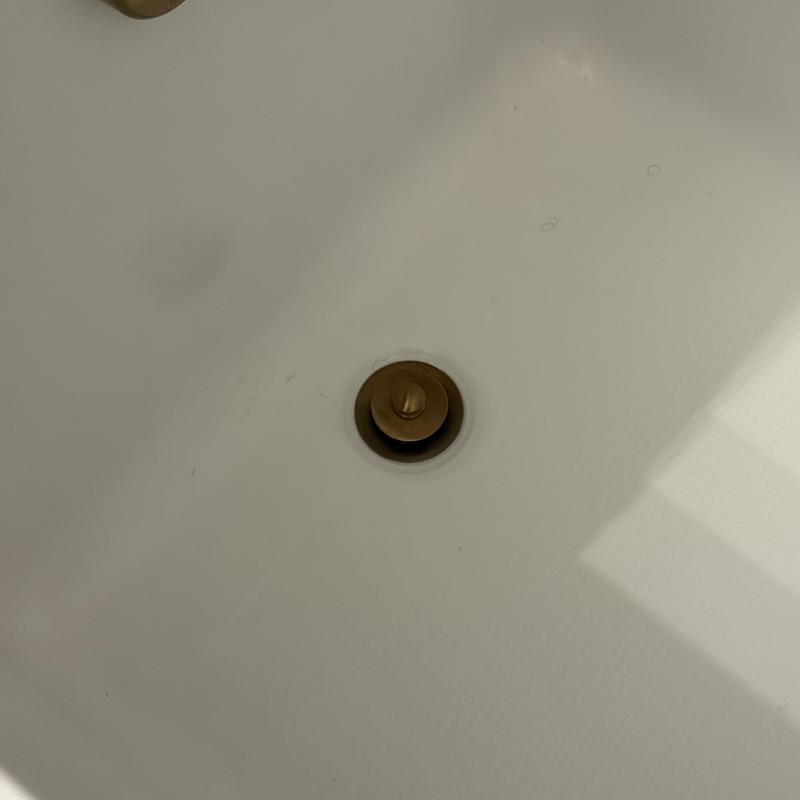 Tub drain stopper reinstalled and adjusted in tub Tub drain stopper reinstalled and adjusted in tub