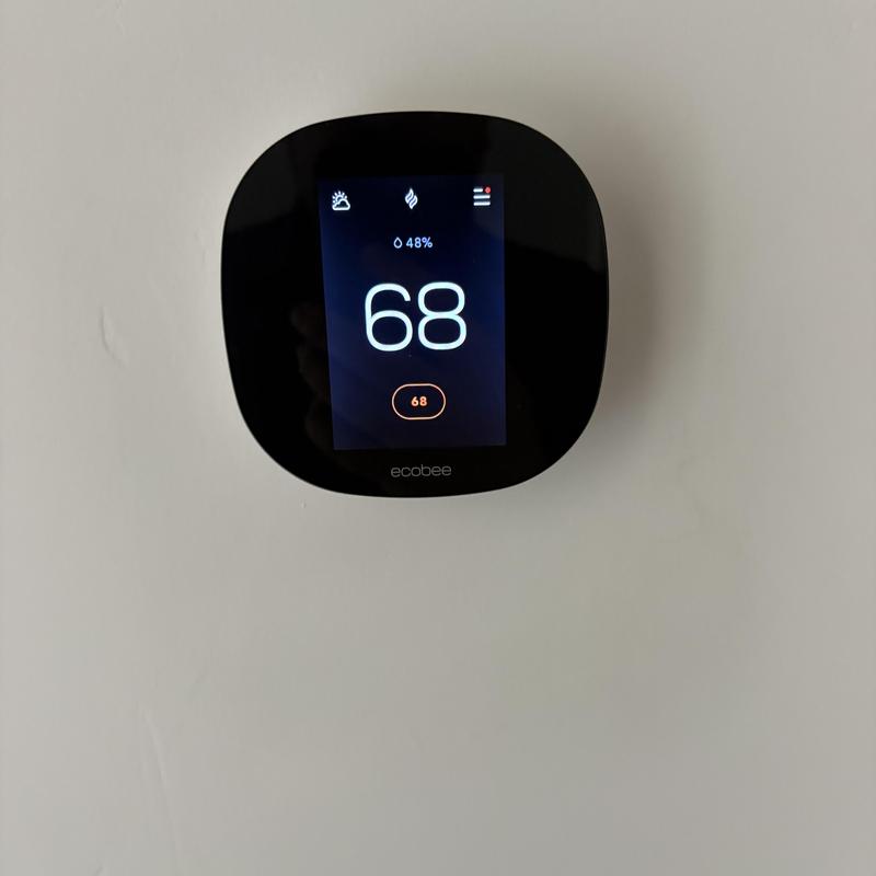 Ecobee smart thermostat displaying 68 degrees temperature