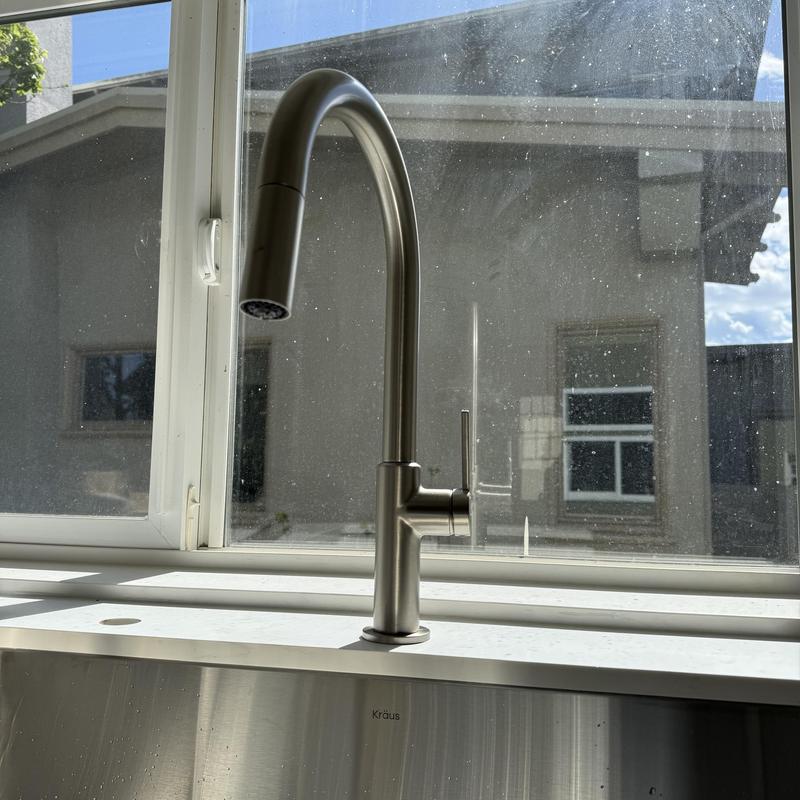 Kitchen faucet installation with stainless steel sink