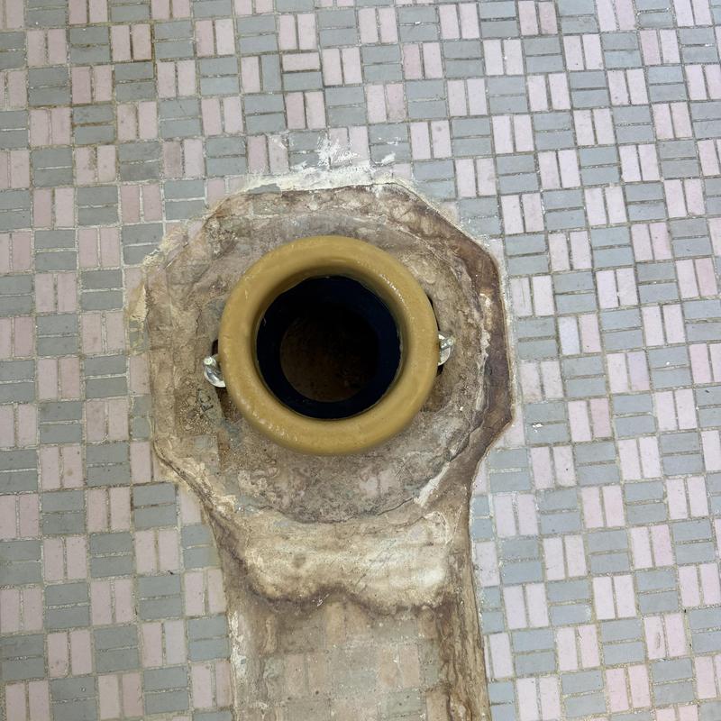 Toilet flange installation on tiled floor