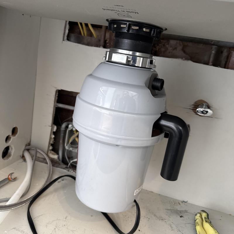 Garbage disposal installation under kitchen sink